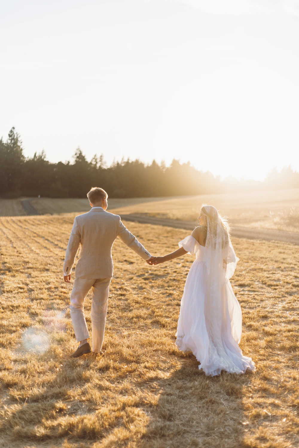 A couple walking together through a field
